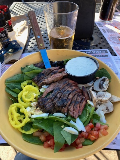 Spinach salad out to lunch with a friend